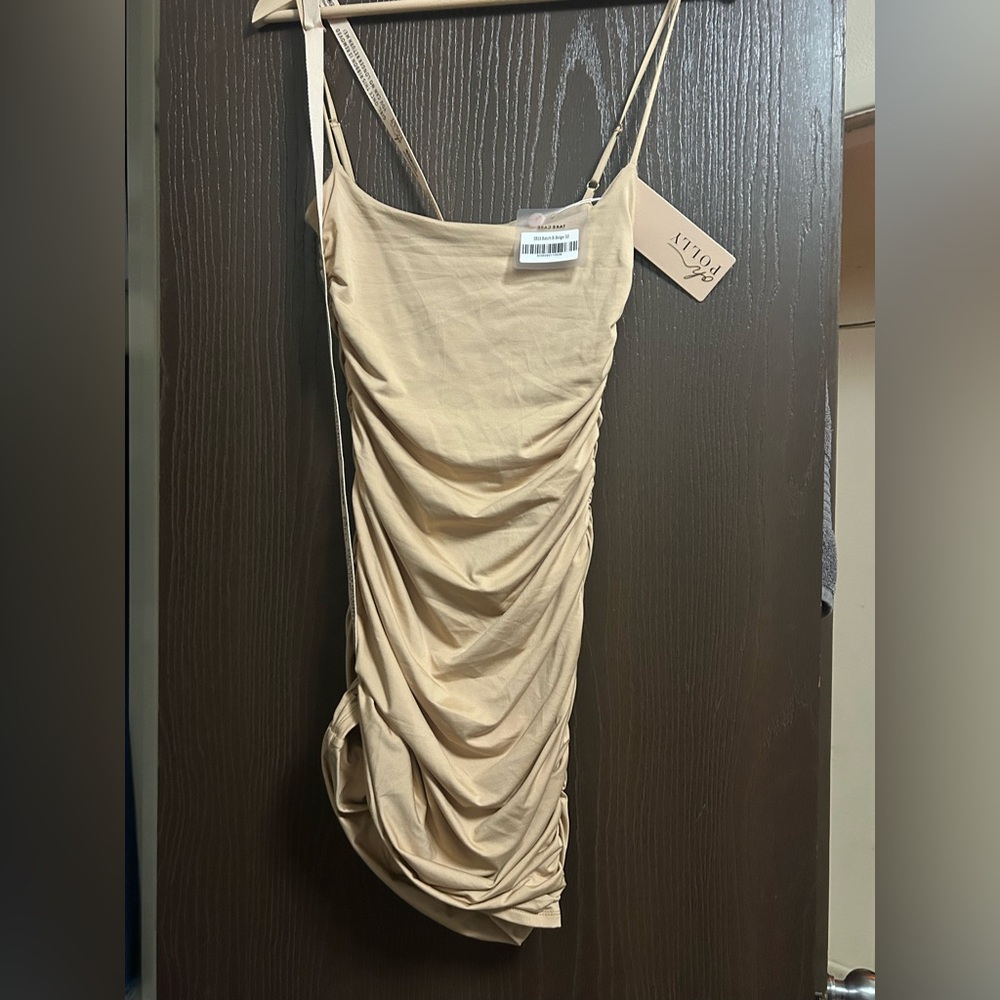 It’s beige dress super comfortable, it has that nice material. Party time